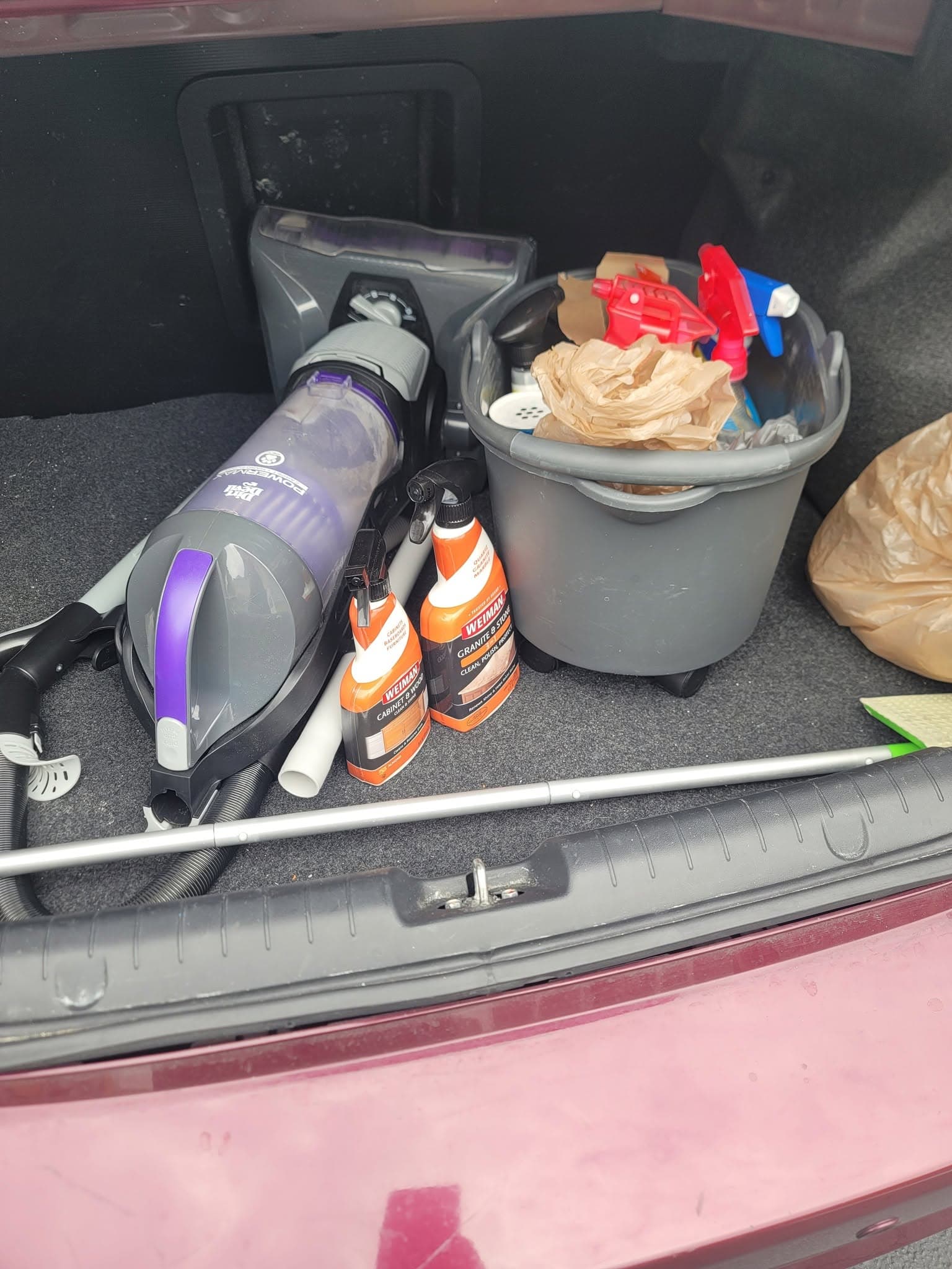 Vacuum and cleaning supplies loaded in a vehicle